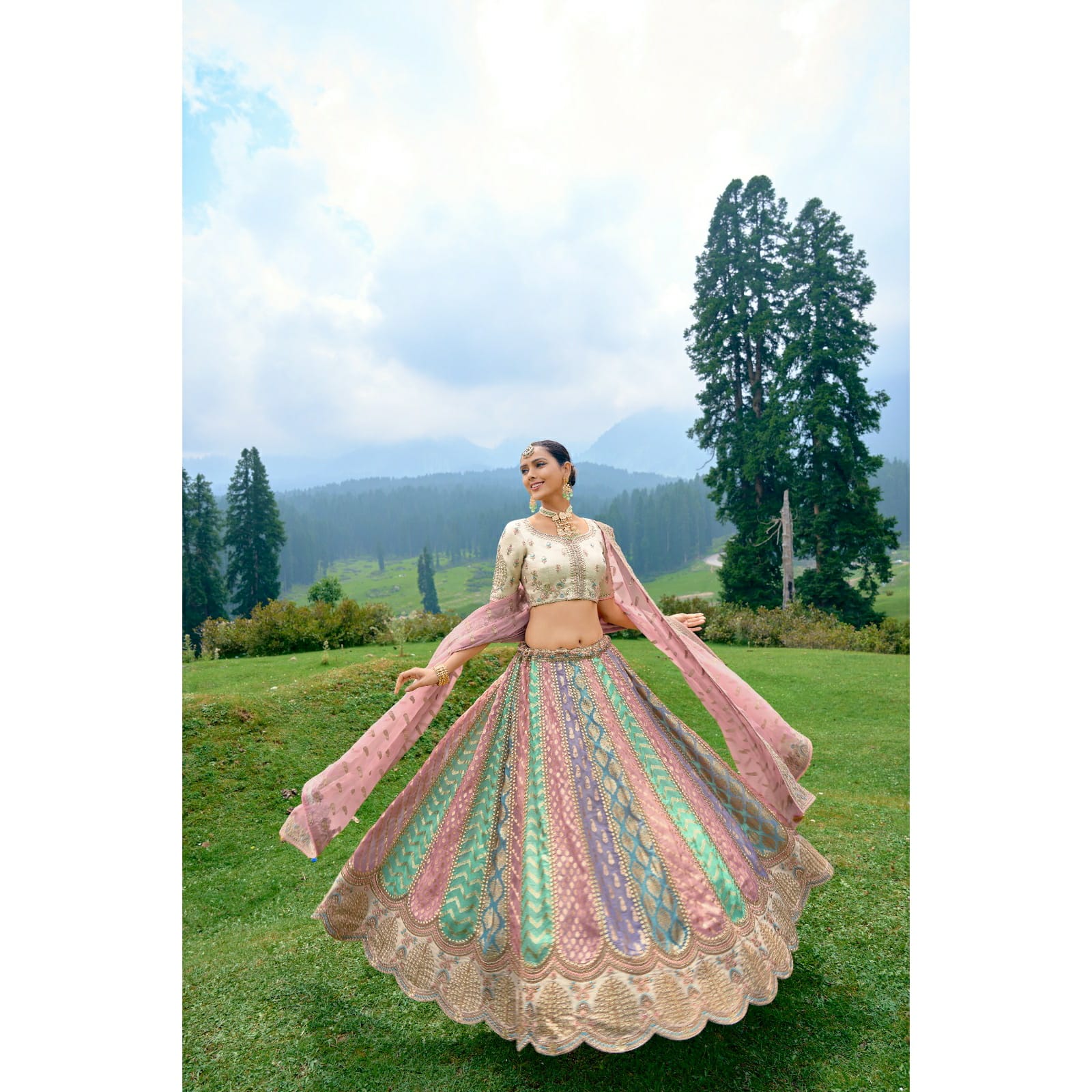 VIBRANT MULTI-COLOURED CIRCULAR LEHENGA SET IN ORGANZA WITH OFF-WHITE TISSUE JARI GOTTA PATI BLOUSE AND PEACH DUPATTA