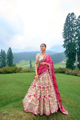 ELEGANT OFF-WHITE CIRCULAR LEHENGA SET IN PURE SATIN WITH OFF-WHITE BLOUSE AND RED PINK BANDHEJ DUPATTA