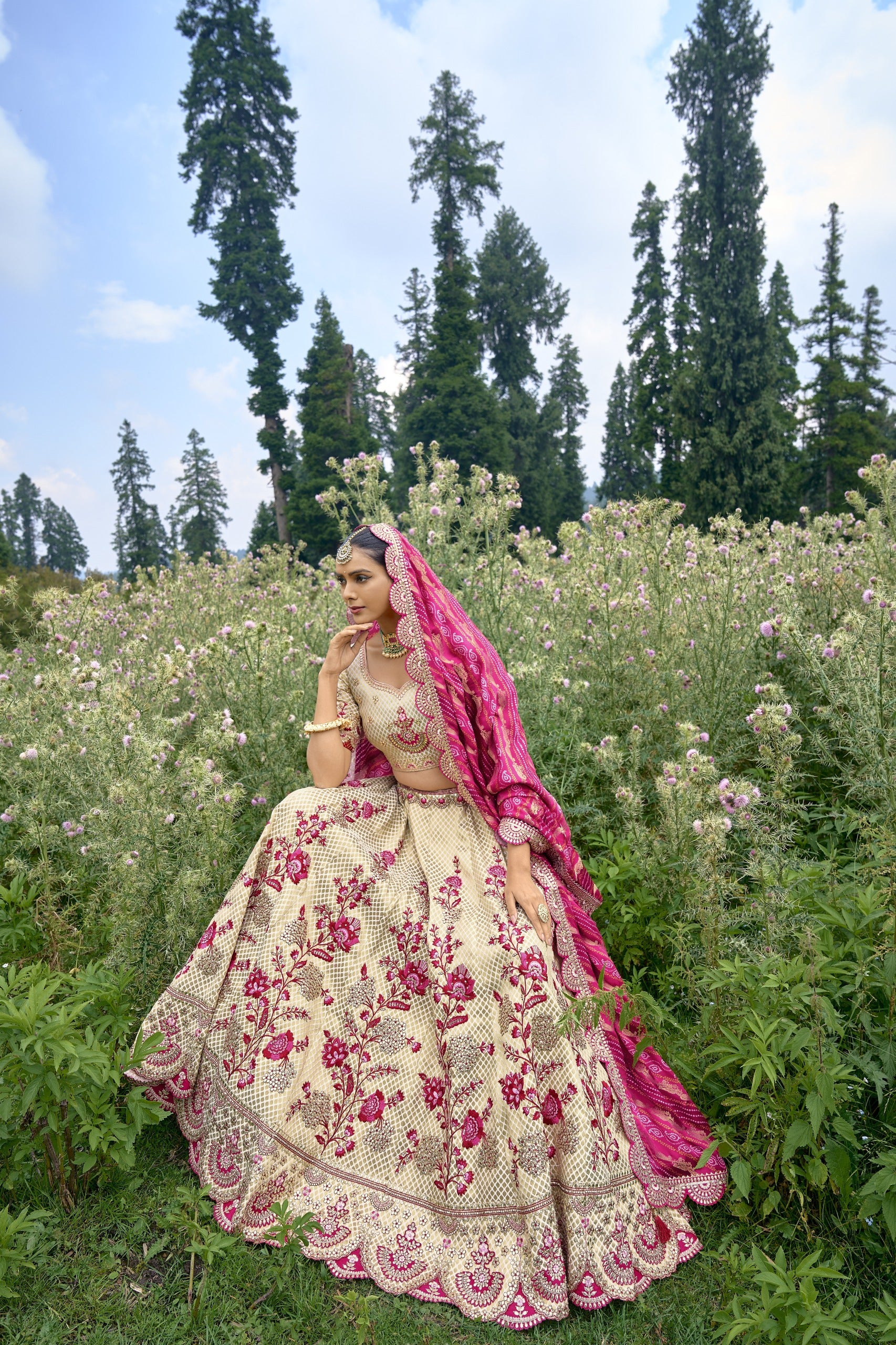 ELEGANT OFF-WHITE CIRCULAR LEHENGA SET IN PURE SATIN WITH OFF-WHITE BLOUSE AND RED PINK BANDHEJ DUPATTA