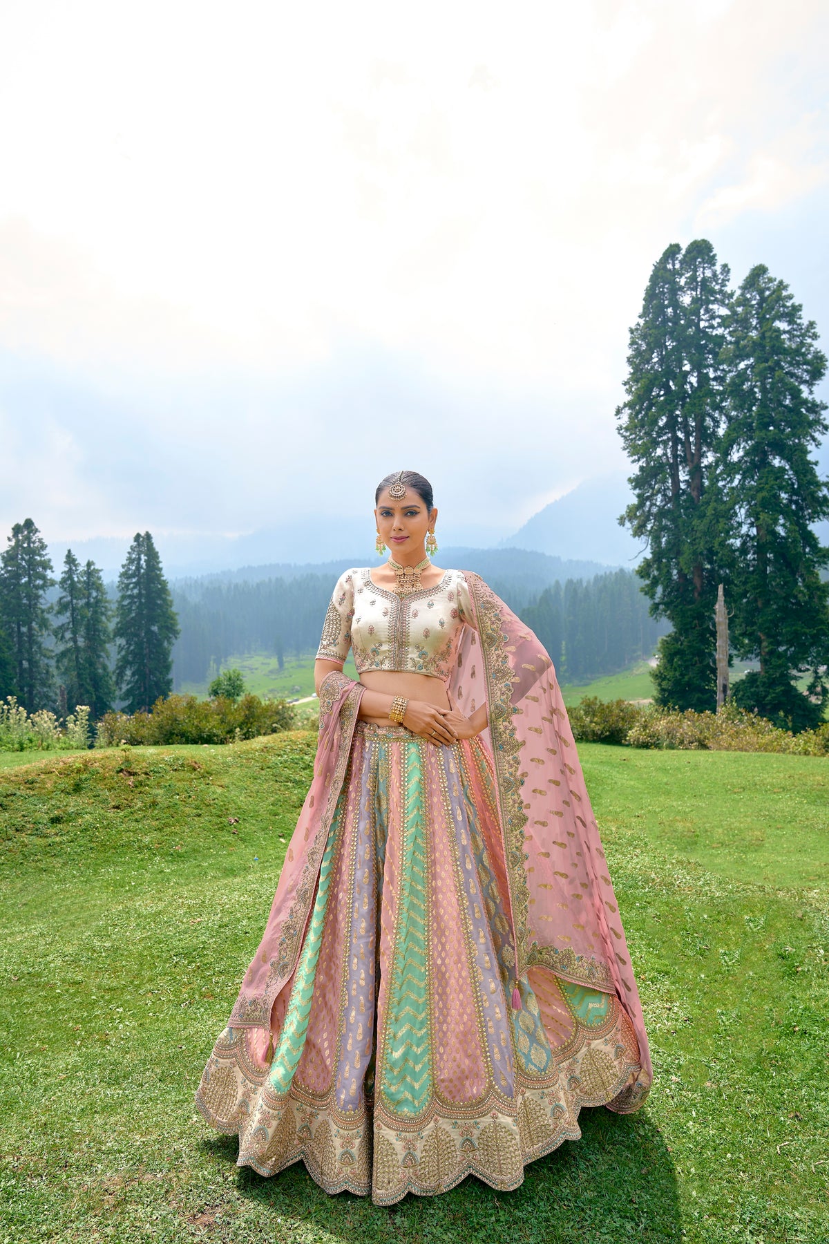 VIBRANT MULTI-COLOURED CIRCULAR LEHENGA SET IN ORGANZA WITH OFF-WHITE TISSUE JARI GOTTA PATI BLOUSE AND PEACH DUPATTA