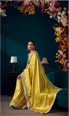 Yellow color Pure Banarasi Kanjivaram fabric saree with heavy work border saree